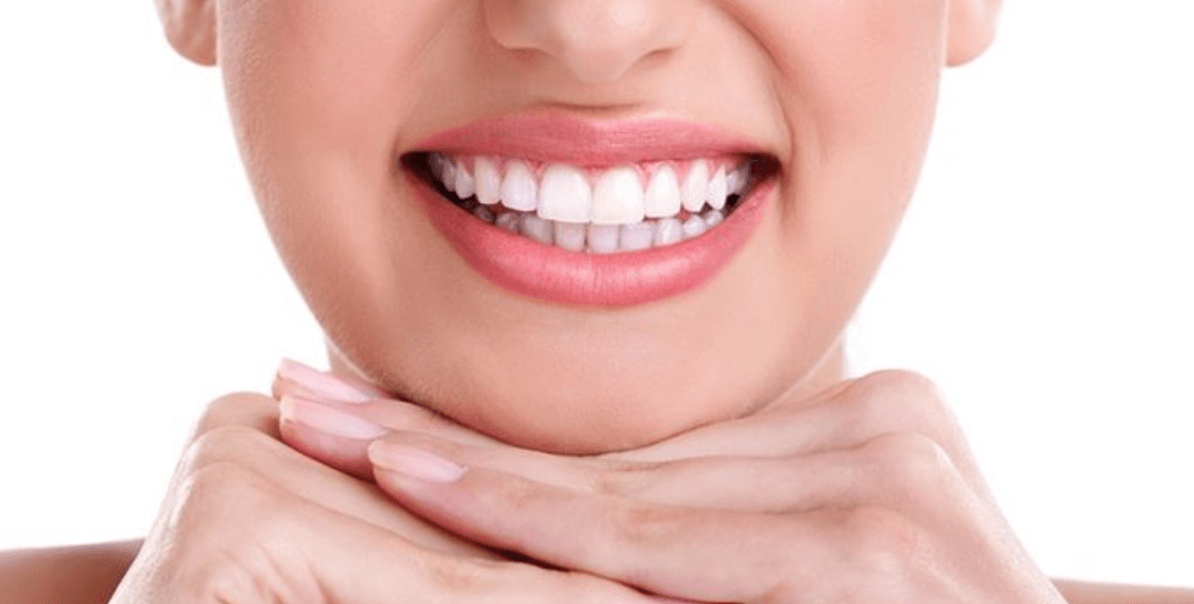 Patient admiring a brighter smile after cosmetic dentistry at Agoura Dental Group in Agoura Hills, California