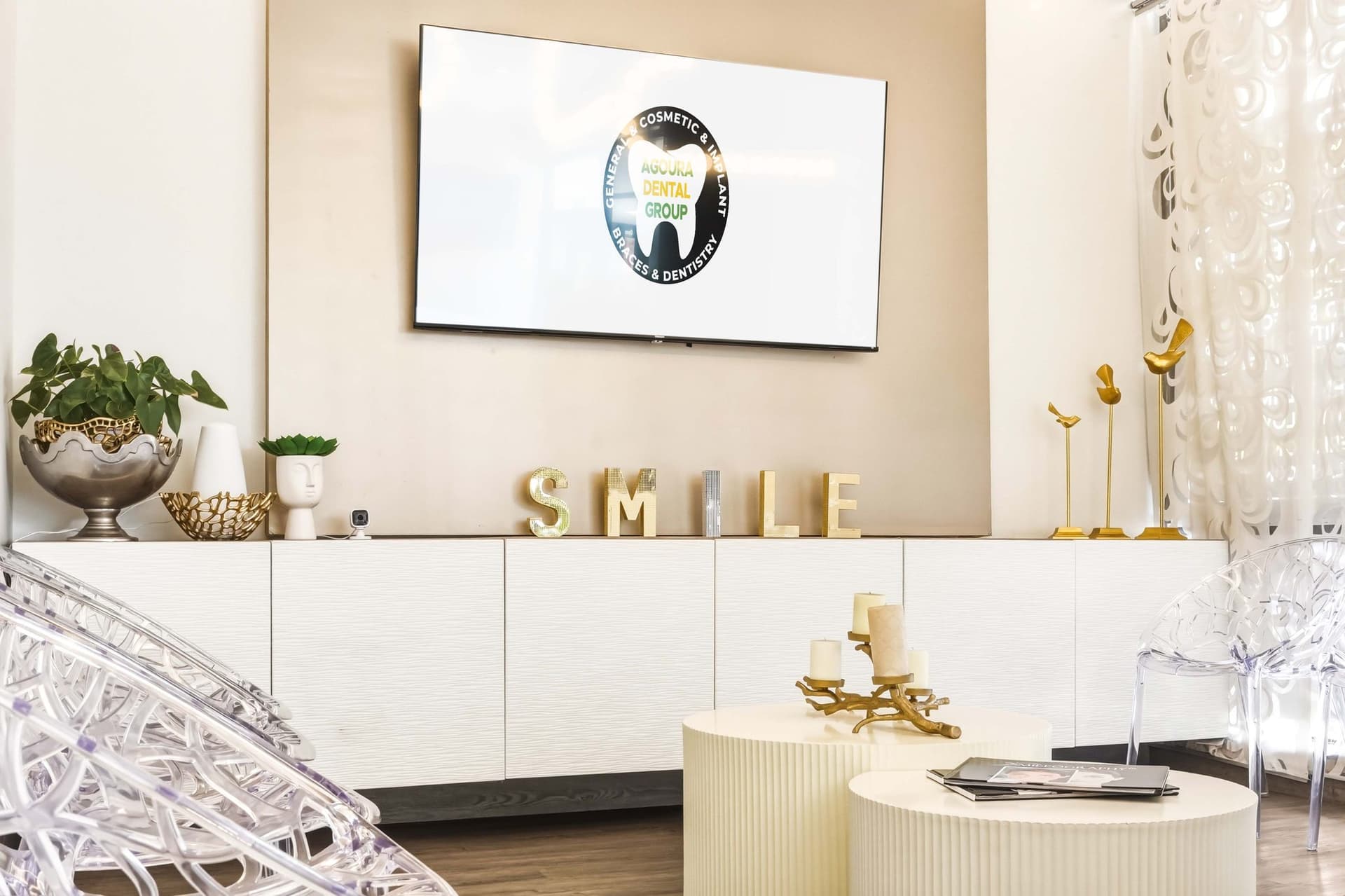 SMILE lettering on the patient lounge wall at Agoura Dental Group